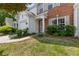 Charming two-story townhouse with brick and vinyl siding, complemented by a well-manicured lawn at 3303 Timbercreek Cir, Roswell, GA 30076