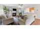 Relaxing living area with a cozy fireplace, comfortable seating, and easy access to the kitchen at 3303 Timbercreek Cir, Roswell, GA 30076