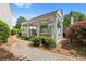 Community mailbox station featuring a covered structure surrounded by trees and landscaping at 3303 Timbercreek Cir, Roswell, GA 30076