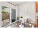 Bright breakfast nook with table and chairs, with sliding door access to outdoor stone patio at 3303 Timbercreek Cir, Roswell, GA 30076