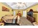 Bright primary bedroom with ceiling fan, bed, and a comfortable vibe at 745 Beaver Pond Trl, Fairburn, GA 30213