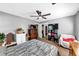 Comfortable bedroom with natural light and a ceiling fan at 745 Beaver Pond Trl, Fairburn, GA 30213