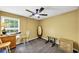 Spare bedroom with ceiling fan, natural light, and minimal furniture at 745 Beaver Pond Trl, Fairburn, GA 30213