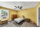 Cozy bedroom with a ceiling fan, natural light from a window, and a simple bed setup at 745 Beaver Pond Trl, Fairburn, GA 30213