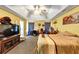 Well decorated Primary bedroom with ceiling fan, TV and a queen size bed at 745 Beaver Pond Trl, Fairburn, GA 30213