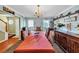 Elegant dining room with chandelier, large table, and decorative shelves at 745 Beaver Pond Trl, Fairburn, GA 30213