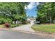 Charming two-story home with a cozy front porch and spacious driveway at 745 Beaver Pond Trl, Fairburn, GA 30213