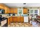 Cozy kitchen with wooden cabinets and a charming window view at 745 Beaver Pond Trl, Fairburn, GA 30213