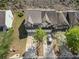 Wide aerial of two-story townhomes with grey roofs, large driveway, and manicured lawns at 2293 Baker Station Dr, Acworth, GA 30101