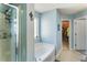 Charming bathroom offers a soaking tub, glass shower, and neutral tile flooring, creating a spa-like retreat at 2293 Baker Station Dr, Acworth, GA 30101