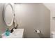 Bright bathroom with white vanity, oval mirror, and neutral color scheme at 2293 Baker Station Dr, Acworth, GA 30101