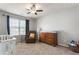 Bedroom featuring a crib, dresser, and comfortable chair by the window at 2293 Baker Station Dr, Acworth, GA 30101