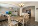 Dining room featuring a rustic dining set with access to the living room and kitchen at 2293 Baker Station Dr, Acworth, GA 30101