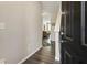 Open entryway featuring hardwood floors, neutral paint, and a view into the cozy living area at 2293 Baker Station Dr, Acworth, GA 30101