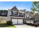 Well-kept townhome with an attached two-car garage, fresh exterior paint, and a cozy neighborhood setting at 2293 Baker Station Dr, Acworth, GA 30101