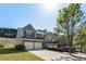 Inviting townhome showcasing a two-car garage, well-maintained lawn, and appealing curb appeal at 2293 Baker Station Dr, Acworth, GA 30101
