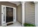 Inviting front door with decorative glass and sidelights, complemented by a welcoming welcome mat at 2293 Baker Station Dr, Acworth, GA 30101