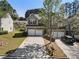 Beautiful gray townhome featuring an attached two-car garage and manicured lawn at 2293 Baker Station Dr, Acworth, GA 30101