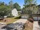 Desirable townhome with two-car garage, green lawn and mature landscaping at 2293 Baker Station Dr, Acworth, GA 30101