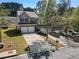 Two-story townhome with attached two-car garage and driveway with manicured lawn at 2293 Baker Station Dr, Acworth, GA 30101