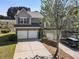 Charming townhome with a two-car garage and a well-maintained front yard at 2293 Baker Station Dr, Acworth, GA 30101