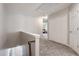 Upstairs hallway features neutral carpet, fresh paint, white doors and bright natural light at 2293 Baker Station Dr, Acworth, GA 30101