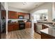 Kitchen boasts modern appliances, generous counter space, and dark wooden cabinetry at 2293 Baker Station Dr, Acworth, GA 30101