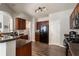 Well lit kitchen with stainless appliances, granite countertops, and dark wood cabinets at 2293 Baker Station Dr, Acworth, GA 30101
