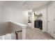 Upstairs laundry room features black front load washer and dryer, storage shelves and neutral carpet at 2293 Baker Station Dr, Acworth, GA 30101