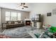 Cozy living room with fireplace, ceiling fan, large TV and natural light. with stylish decor at 2293 Baker Station Dr, Acworth, GA 30101
