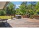 Backyard deck with hot tub and lush landscaping, perfect for relaxing at 2710 Hayden Dr, East Point, GA 30344