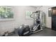 Basement gym area with elliptical machine and large windows at 2710 Hayden Dr, East Point, GA 30344
