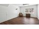 Spacious bedroom boasting dark wood floors, natural light, and a ceiling fan at 2710 Hayden Dr, East Point, GA 30344
