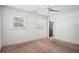 Bright and airy bedroom with neutral tones, ample windows, and a ceiling fan at 2710 Hayden Dr, East Point, GA 30344