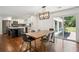 Dining area featuring hardwood floors, modern lighting, and direct access to the outdoor space at 2710 Hayden Dr, East Point, GA 30344