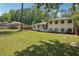Charming two-story home boasts a freshly painted exterior, well-manicured lawn, and inviting front entrance at 2710 Hayden Dr, East Point, GA 30344