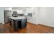 Modern kitchen with stainless steel appliances, white cabinets, and a large center island at 2710 Hayden Dr, East Point, GA 30344