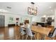 Open-concept living and dining area with hardwood floors and lots of natural light at 2710 Hayden Dr, East Point, GA 30344