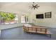 Bright sunroom with a whitewashed brick wall, tile floor, and backyard view at 2710 Hayden Dr, East Point, GA 30344