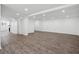 Large finished basement area with wood-look floors and bright recessed lighting at 335 Amberidge Trl, Atlanta, GA 30328