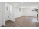 Finished basement with wood-look flooring, fireplace, and laundry closet at 335 Amberidge Trl, Atlanta, GA 30328