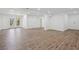 Spacious finished basement featuring wood-look flooring, white walls, and recessed lighting at 335 Amberidge Trl, Atlanta, GA 30328