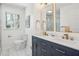 Bathroom featuring double sinks, marble floors, modern fixtures, and natural light from the window at 335 Amberidge Trl, Atlanta, GA 30328
