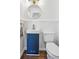 Chic powder room featuring a stylish vanity with a round mirror, and wood-look flooring at 335 Amberidge Trl, Atlanta, GA 30328
