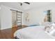 A view of the bedroom with hardwood floors featuring a modern sliding door leading to the bathroom at 335 Amberidge Trl, Atlanta, GA 30328
