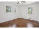 Bedroom featuring hardwood floors, a ceiling fan, and natural light from dual windows at 335 Amberidge Trl, Atlanta, GA 30328