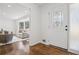 Bright foyer with hardwood floors and decorative glass door leading to the living area at 335 Amberidge Trl, Atlanta, GA 30328