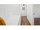 Hallway featuring a built in bench with hardwood floors and white walls at 335 Amberidge Trl, Atlanta, GA 30328
