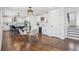 Bright kitchen featuring white cabinets, herringbone backsplash, wine cooler, and a dining area with wood floors at 335 Amberidge Trl, Atlanta, GA 30328