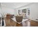 Bright living room with hardwood floors, fireplace, and large windows providing natural light at 335 Amberidge Trl, Atlanta, GA 30328